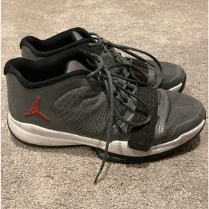 Air Jordan BCT Low sneakers that are dark gray with black lining. Made in 2011
